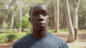 Video portrait of a male, person of color in his thirties working out outside in an outdoor park in  Morocco , north africa.  