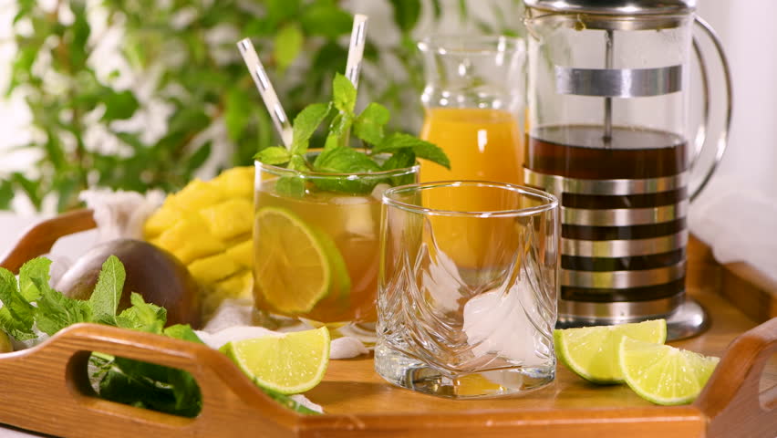 Make Mango iced tea with lime and mint. Refreshing organic soft drink Royalty-Free Stock Footage #1106019643
