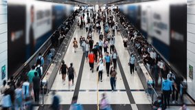 Vertical timelapse of Asian people walk travelator escalator at Hong Kong Central subway underground station. Public transportation, Asia city life, commuter urban lifestyle concept. High angle view - Powered by Shutterstock - Get 15% off with code: PIKWIZARD15