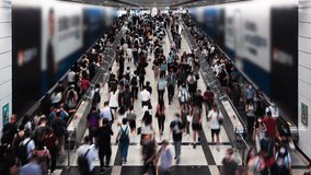 Vertical timelapse of Asian people walk travelator escalator at Hong Kong Central subway underground station. Public transportation, Asia city life, commuter urban lifestyle concept. High angle view - Powered by Shutterstock - Get 15% off with code: PIKWIZARD15
