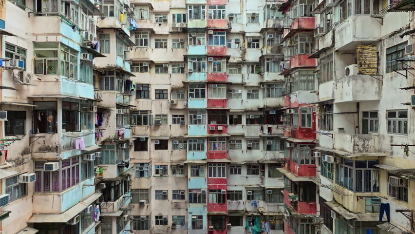 Yick Cheong and Yick Fat old apartment house exterior architecture in Hong Kong city, drone aerial view. Asian people residential life, transformer building or monster building travel landmark Royalty-Free Stock Footage #1106020209