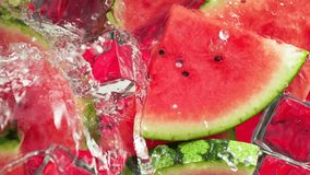 Super Slow Motion Shot of Water Wave Splashing on Watermelon Slices and Ice Cubes at 1000fps. - Powered by Shutterstock - Get 15% off with code: PIKWIZARD15