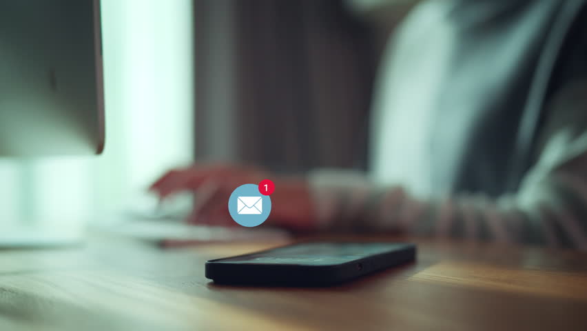 Smart phone mobile receiving mail message, email notification, Woman employee use mobile phone after receiving an email message while sitting at work desk. | Shutterstock HD Video #1106023547