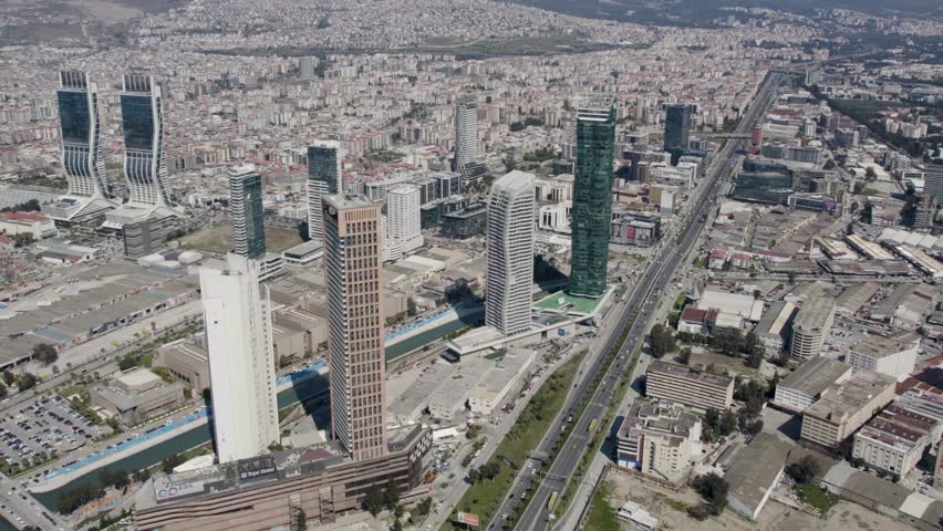 Izmir, Turkey  Aerial footage view of Izmir city from above Izmir bay sea with the skyscrappers which ones Folkart Towers, mistral, Ege Perla and Bayrakli region Royalty-Free Stock Footage #1106030527