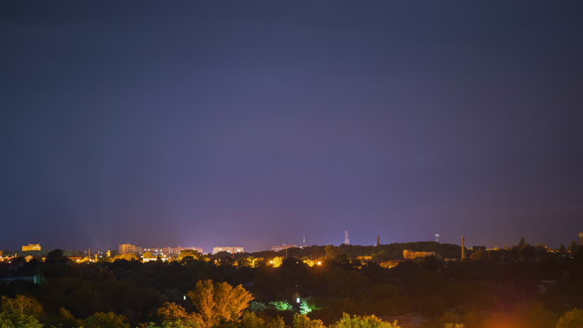 Change of seasons over a small town. Transition from day to night. Sunset over the city turns into dawn and day. Two days timelapse video