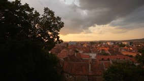 Sunset in Sibiu. 4K video time lapse with amazing sunset sky over Sibiu city in Transylvania. Travel to Romania.