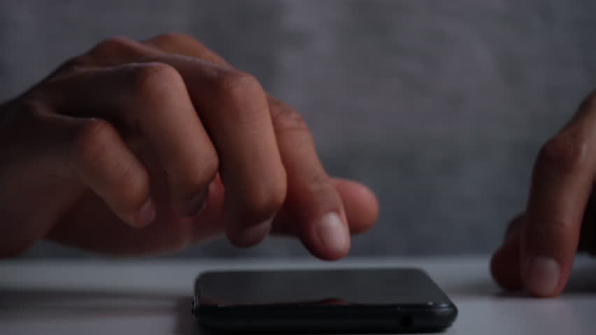 A men using smart phone for analyze a stock market exchange. Business data number futuristic hologram background. | Shutterstock HD Video #1106042689