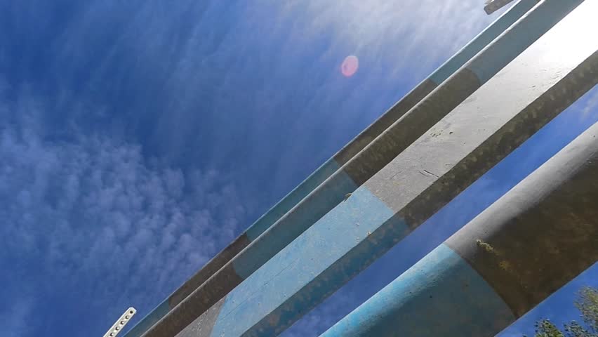 Jump over obstacles. Close-up on horse hooves.
Slow motion shot of the horse jumping from below.
