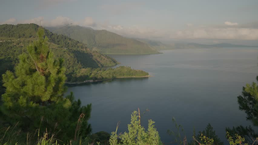 Danau Toba view from Tarabunga Hill - a Large Natural Lake in North Sumatra, Indonesia, Occupying The Caldera of a Supervolcano Royalty-Free Stock Footage #1106049035