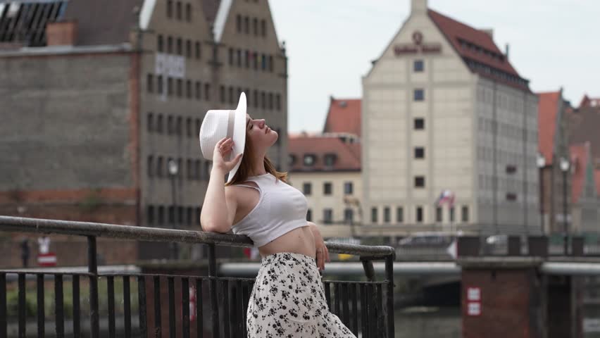 girl in a white hat on the background of Gdansk Europe Poland