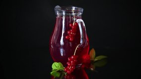 Cold refreshing drink from fresh summer berries in a decanter.