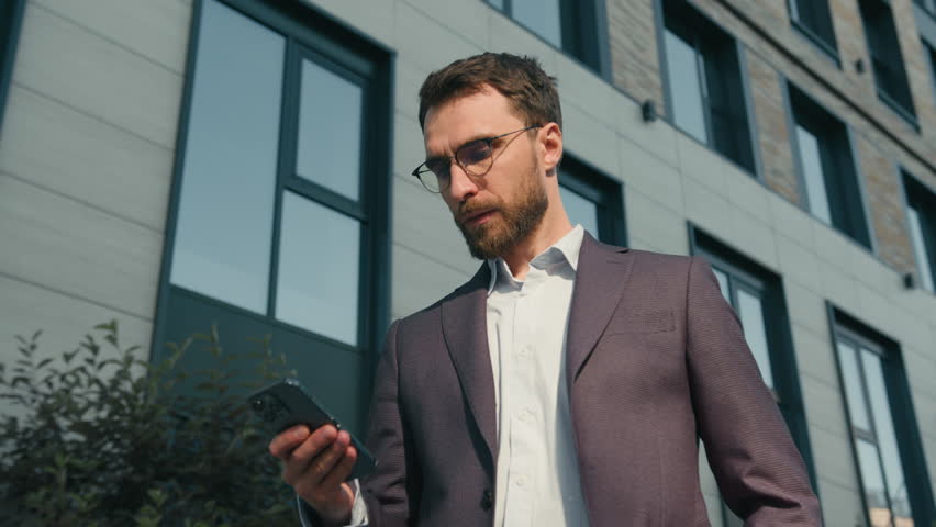 Caucasian angry male entrepreneur man answer call talk phone arguing in city near office stressed guy irritated talking frustrated businessman finish mobile conversation end business conflict outdoors Royalty-Free Stock Footage #1106058173