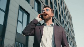 Caucasian angry male entrepreneur man answer call talk phone arguing in city near office stressed guy irritated talking frustrated businessman finish mobile conversation end business conflict outdoors - Powered by Shutterstock - Get 15% off with code: PIKWIZARD15