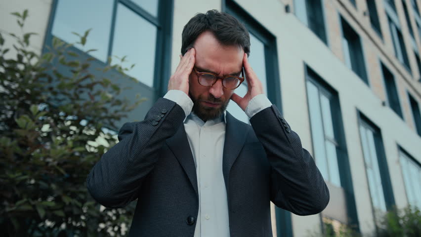 Tired Caucasian man business entrepreneur office manager feel pain eyestrain discomfort overworked in city sick guy unwell businessman rubbing eyes take off glasses bad vision suffer headache migraine Royalty-Free Stock Footage #1106058177