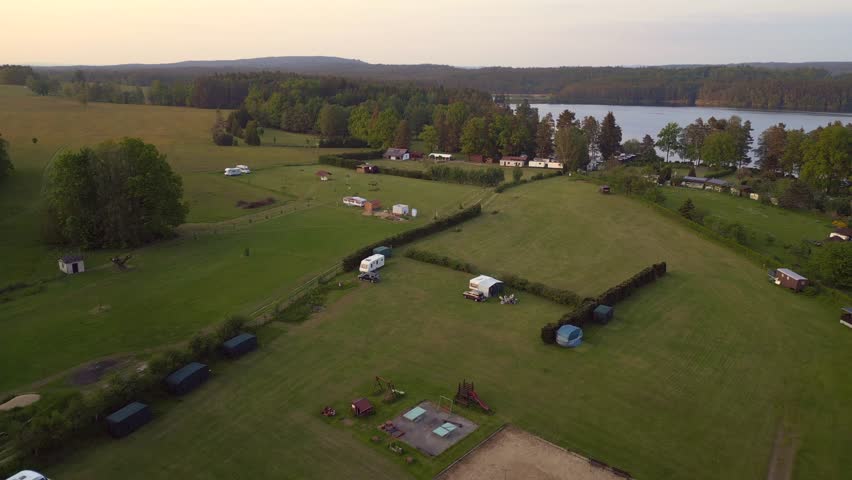 evening camping village Stankov at potok lake Magic aerial top view flight drone