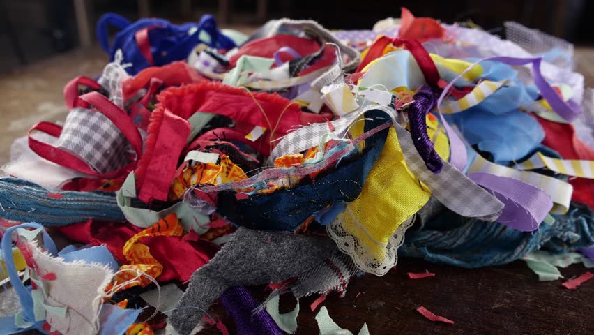 Textile clippings waste in garment Industry. The cutting process of garment manufacturing creates the fabric wastage Royalty-Free Stock Footage #1106061045