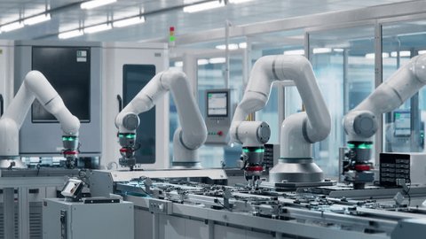 Advanced High Precision Robot Arms at Bright Electronics Factory. Fully Automated Modern PCB Assembly Line. Electronic Devices Production Industry. Component Installation on Circuit Board. Adlı Stok Video