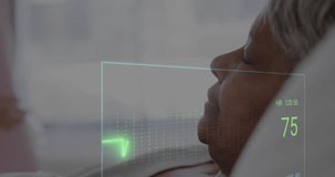 Animation of colourful cardiographs over diverse female nurse and patient in hospital bed. Medicine, health and digital interface concept, digitally generated video.