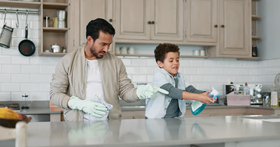 Cleaning, help and spray with father and son for dust, furniture and housekeeping. Learning, cleaner and hygiene with man and child in family home for kitchen, maintenance and housework together Royalty-Free Stock Footage #1106085141