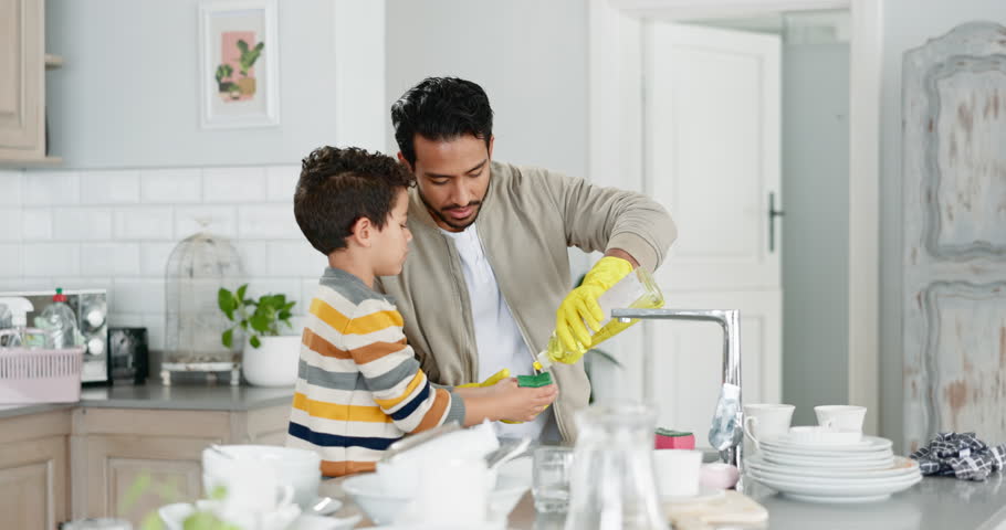 Teaching kid, dad and cleaning the dishes in the kitchen, family home and boy learning, helping and washing with soap and water. Father, son and together to clean and work on housekeeping chores Royalty-Free Stock Footage #1106085229