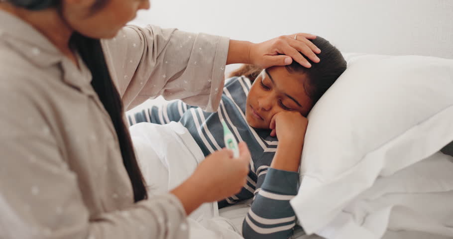 Bed, thermometer check or kid sick from bacteria virus, cold or disease with worried mother help, aid or support. Bedroom, Indian family and mom feel forehead for temperature assessment of ill child | Shutterstock HD Video #1106085653