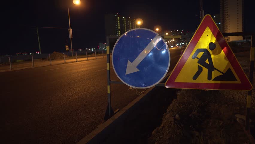 Road Repair Sign and Detour Sign on the Roadside at Night on the Track Royalty-Free Stock Footage #1106088593