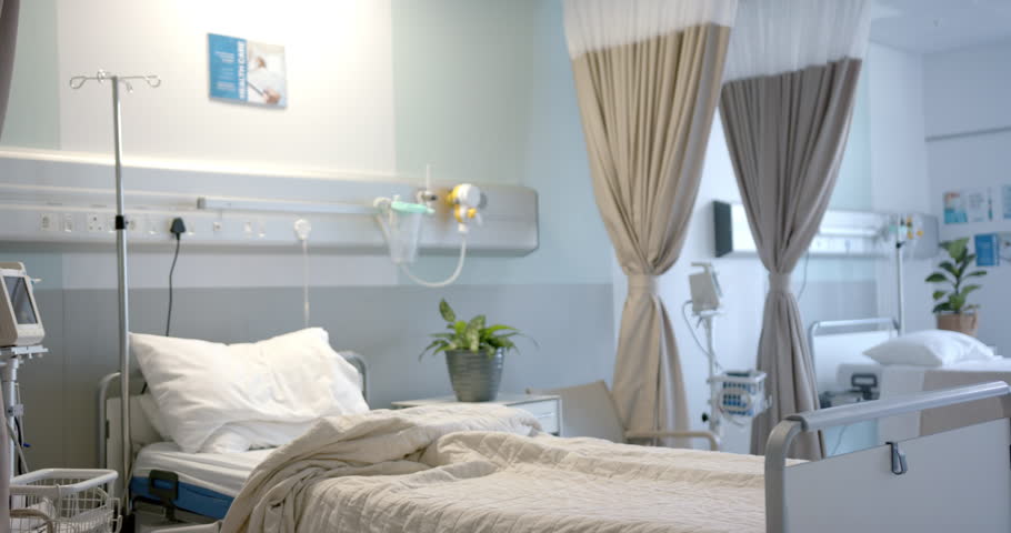 Hospital room with beds, plants and beige curtains, slow motion. Medicine, healthcare services, interior and hospital, unaltered. Royalty-Free Stock Footage #1106088627