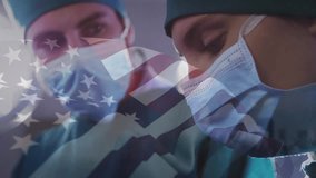 Animation of waving usa flag over caucasian male and female surgeon surgery operation at hospital. Medical healthcare and patriotism concept - Powered by Shutterstock - Get 15% off with code: PIKWIZARD15