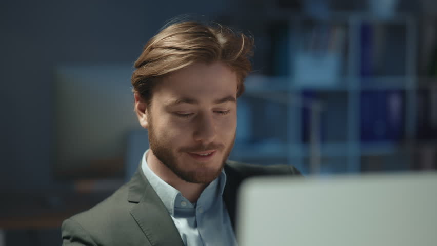 Happy caucasian bearded male manager using dekstop computer browsing news messaging with girlfriend working online at coworking space office interior. | Shutterstock HD Video #1106090315