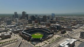 Downtown Denver Coors field Colorado Rockies baseball stadium Rocky Mountain landscape Mount Evans aerial drone cinematic foothills Colorado cars traffic spring summer circling left - Powered by Shutterstock - Get 15% off with code: PIKWIZARD15