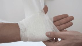Medical bandage. Medical bandage on patient hand in clinic. Traumatology. Hospital. Injured. Therapy. Care. High quality 4k footage - Powered by Shutterstock - Get 15% off with code: PIKWIZARD15