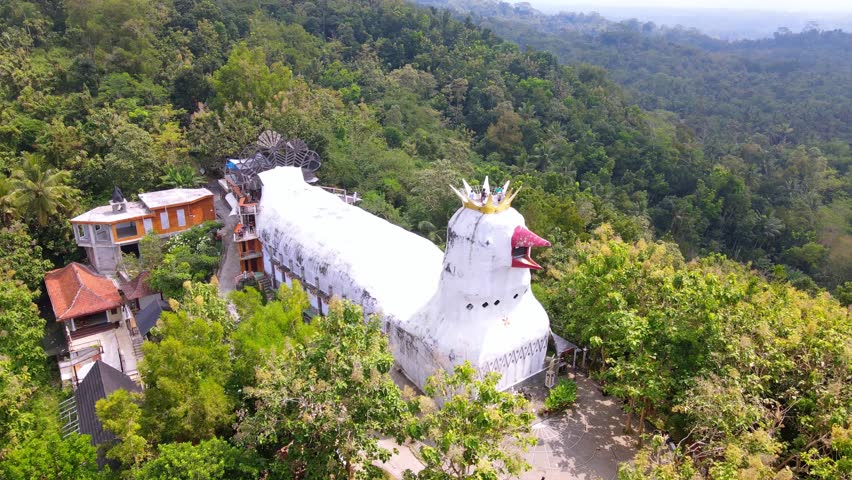 Aerial view of Chicken Church or Gereja Ayam, located on Rhema Hill in Indonesia. Royalty-Free Stock Footage #1106099819