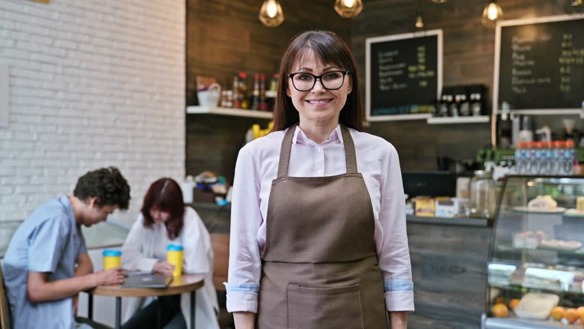 Portrait of confident smiling middle aged woman coffee shop owner Royalty-Free Stock Footage #1106108817