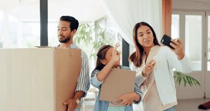 Parents, kid and video call at new home with boxes, wave and hello for communication, live stream and moving. Father, mother and daughter with webinar, contact and chat with cardboard pack in house