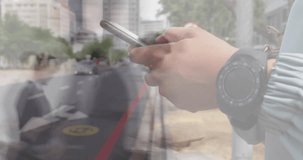 Animation of caucasian man using smartphone over people walking and cityscape. Global business, finances, digital interface, computing and data processing concept digitally generated video.