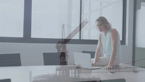 Animation of caucasian businesswoman in office over crane in construction site. Global business, finances, digital interface, computing and data processing concept digitally generated video. - Powered by Shutterstock - Get 15% off with code: PIKWIZARD15