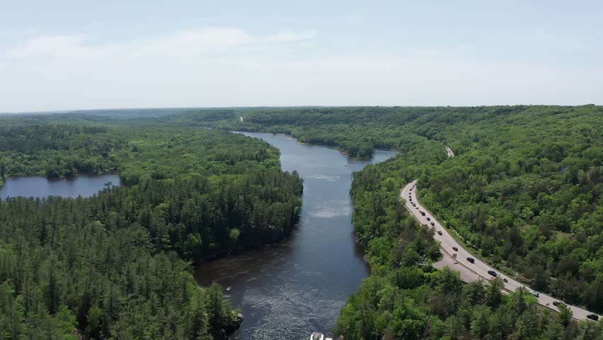 Aerial wide descending shot of the Saint Croix River along the state line of Minnesota and Wisconsin. 4K