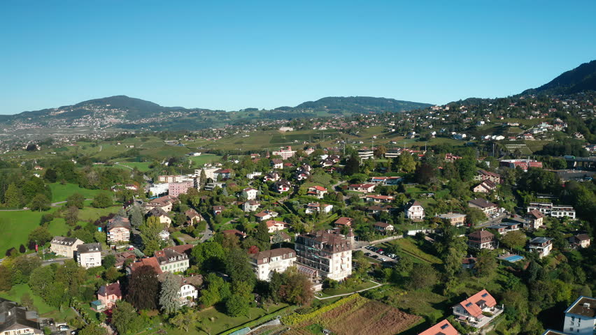 The city of Montreux, Switzerland in a mountainous area. The mountains of the Alps in the background.Meadows