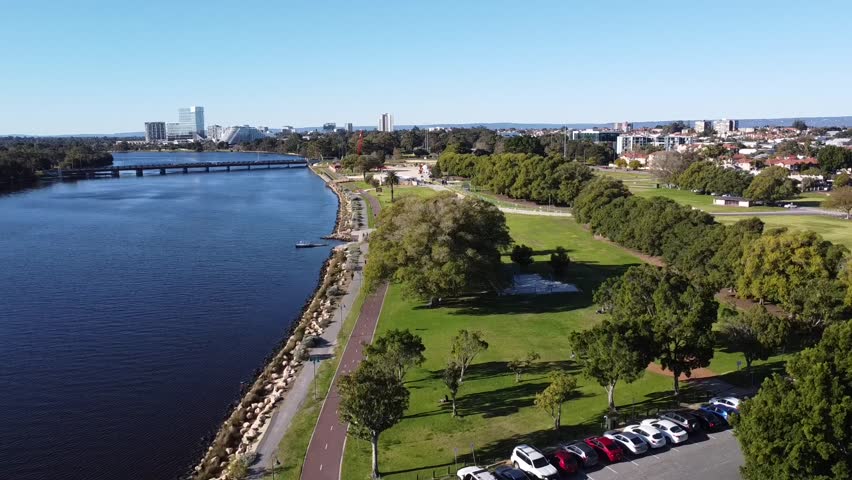 Drone shot descending over Optus Stadium, Crown Casino Burswood, Swan River and Causeway Bridge