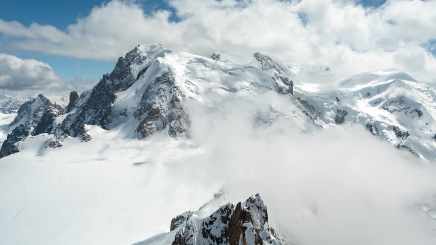 Timelapse, Clouds Moving Above Snow Capped Peak on Sunny Day, Mont Blanc, Chamonix, France