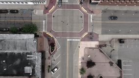 Intersection in downtown Elkhart, Indiana with drone video tilting up.
