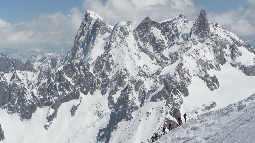 Mountaineers on Snow Capped Mountain Hills, Climbing on High Elevation. Mont Blanc, French Alps