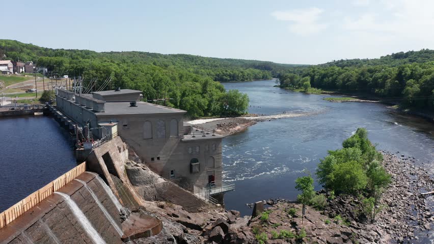 Aerial close-up panning shot of the Hydro-Electric power plant in Saint Croix Falls, Wisconsin. 4K
