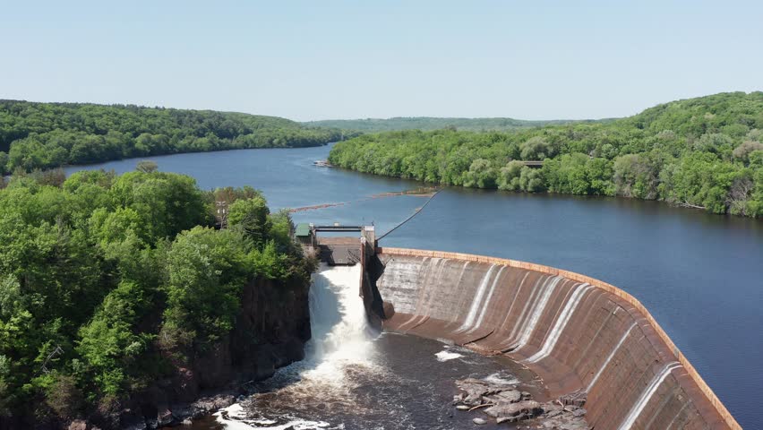 Aerial descending close-up shot of the Saint Croix Falls Hydro-Electric Dam in Wisconsin. 4K