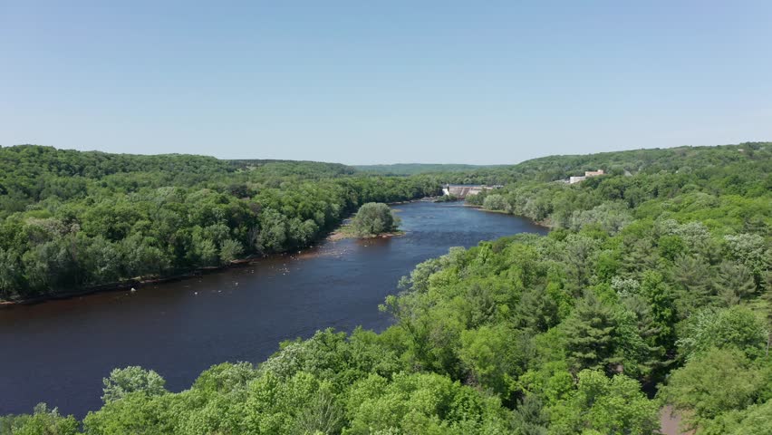 Low aerial shot flying over the Saint Croix River towards Saint Croix Falls, Wisconsin. 4K