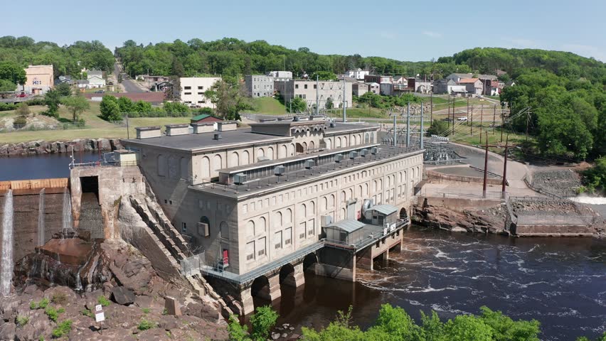 Aerial low close-up shot of the Hydro-Electric power station in Saint Croix Falls, Wisconsin. 4K