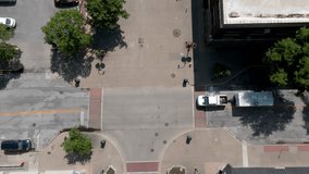 Downtown Rock Island, Illinois with drone video overhead intersection with pick up truck hauling trailer.