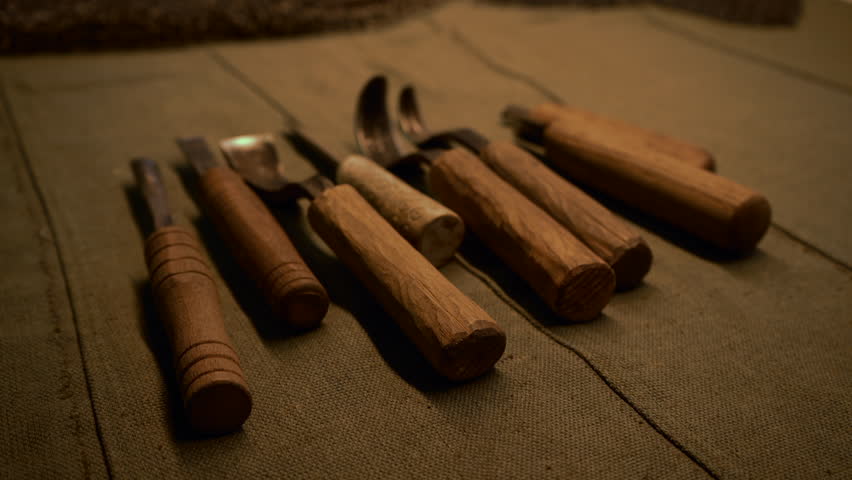 Old Russian devices. Media. A dark table with large iron earth pickers made of iron.