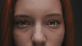 Blue or green eyes of a lovely cute red haired Caucasian girl, looking at the camera in studio. The female flirts and opens her eyes. Happy millennial women model professional close-up front portrait - Powered by Shutterstock - Get 15% off with code: PIKWIZARD15