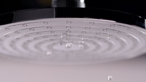 Slow Motion Of Drops Of Water Dripping From The Shower Head